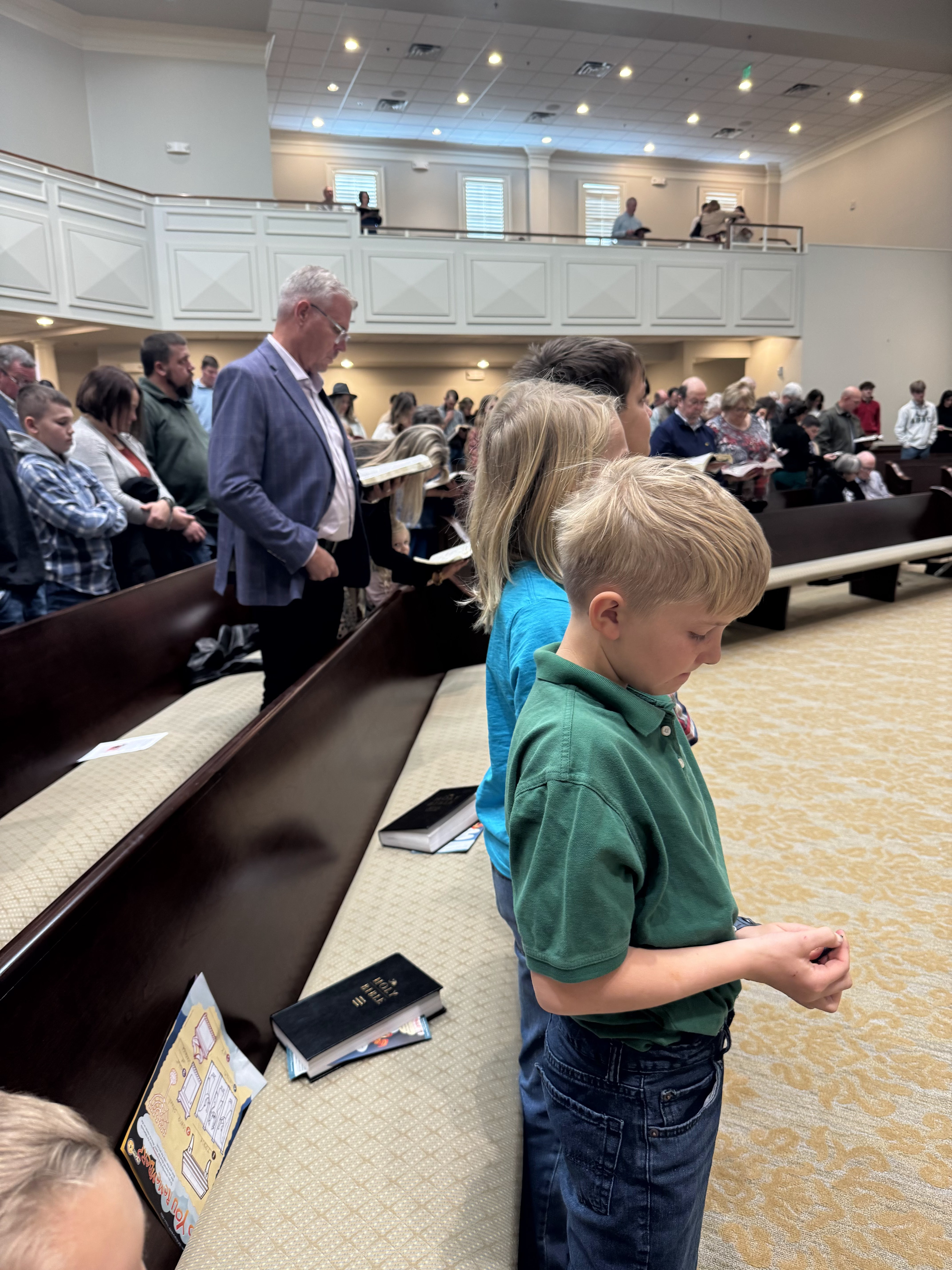 Church member welcoming children to Sunday morning class at FBC Waynesboro