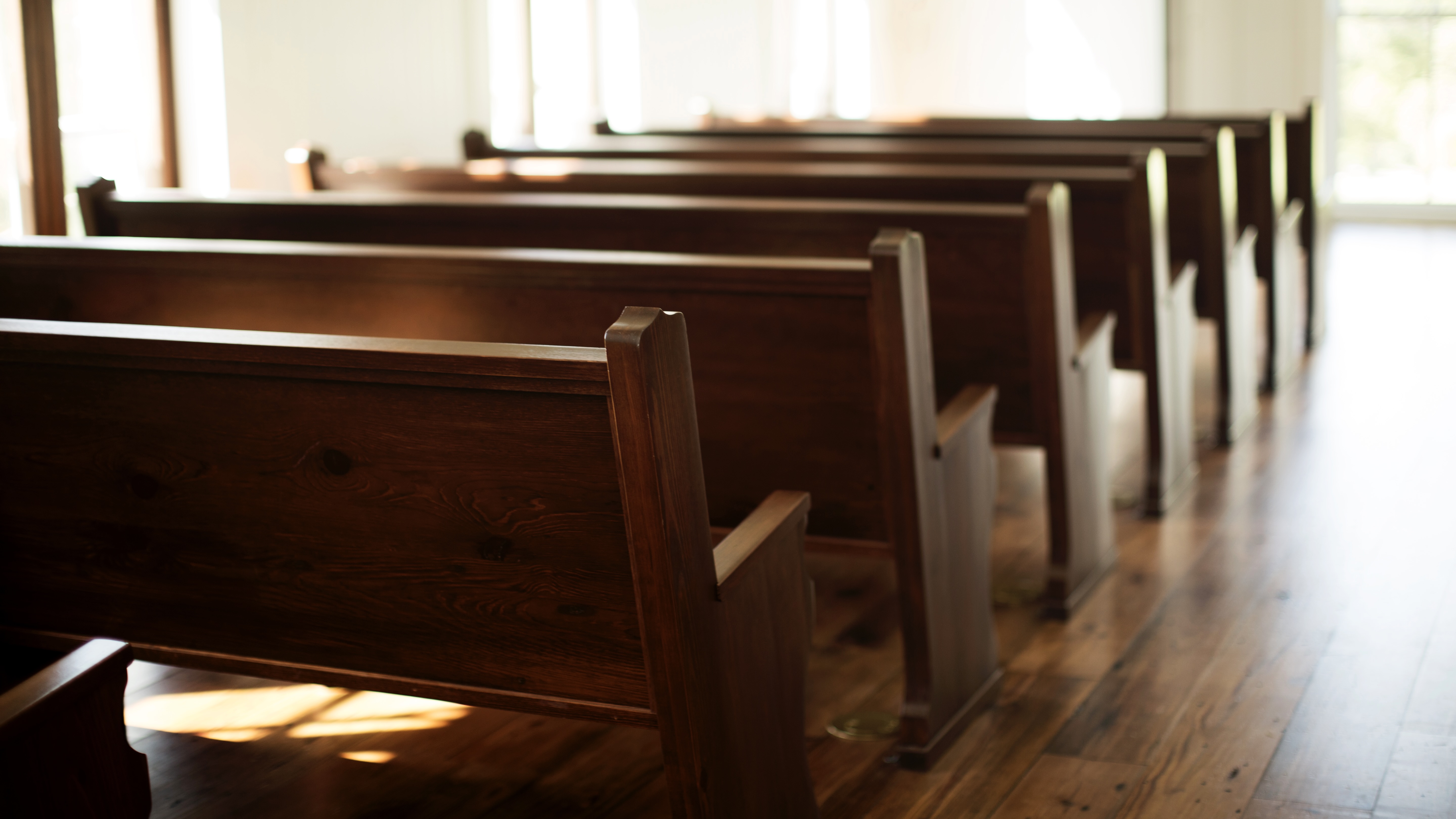 rows_of_empty_pews_in_a_church-5760x3840