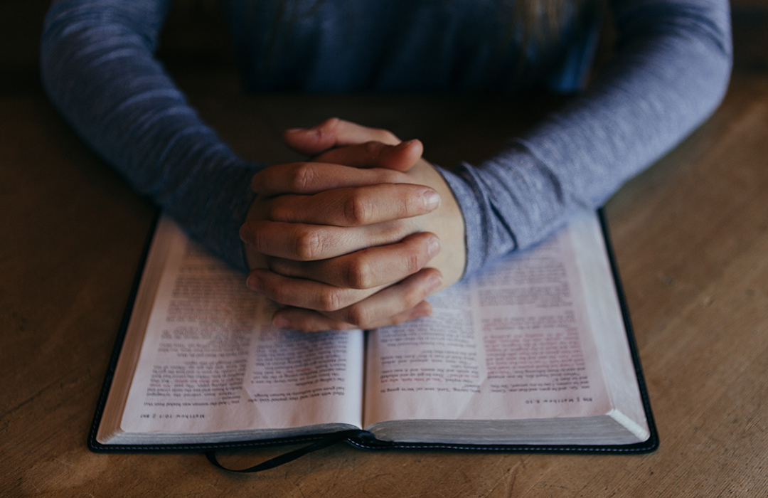 praying-hands-on-bible image