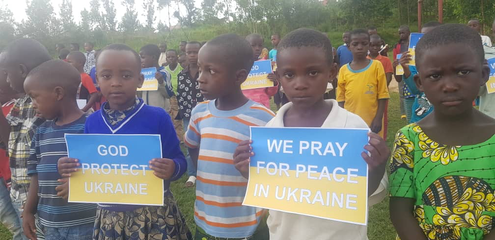 Praying for Ukraine Rwanda signs