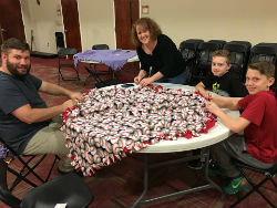Toby Pegram and middle school ministry make blankets for hospice