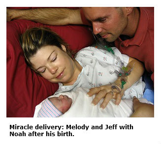 Photo of Melody and Jeff Chandler meeting their son Noah shortly after his birth