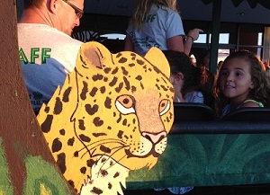 child admires leopard image on Jungle Jaunt VBS adventure ride