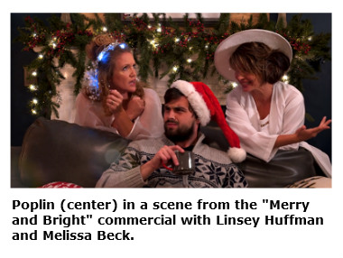 Linsey Huffman, Drew Poplin and Melissa Beck in a scene from the Merry and Bright commercial