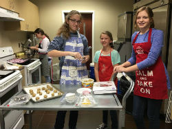 Members of The Crossing middle school ministry at Triad baking cookies for hospice