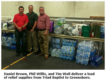 Triad Baptist members Daniel Brown, Phil Willis, and Tim Wall with relief donations