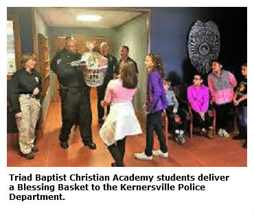 Triad Baptist Christian Academy students deliver gift baskets to the Kernersville Police Department for Christmas