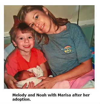 Photo of Melody Chandler and son Noah with her daughter, Marisa, after her adoption
