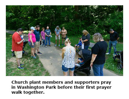 City Park Church plant members and supporters pray in Washington Park before their first prayer walk