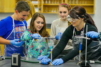 Triad Baptist Christian Academy students in science lab with teacher